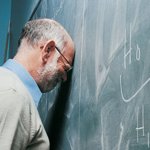 teacher head against chalkboard