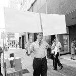 George Lincoln Rockwell Holding Sign
