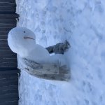 Leaning snow person