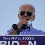 Biden Coughs in hand with mask