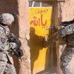 Army kicking down door