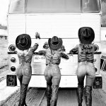 Sexy cowgirls pushing bus