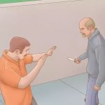 Man about to stab another with a knife
