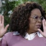 Oprah hands up