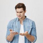 Man gawking at phone