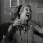 Bette Davis laughing