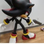 Shadow pointing gun at Sonic