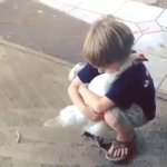 kid hugging chicken
