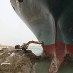 Giant ship tiny excavator at Suez canal