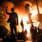 Fire burning building rioters protesters