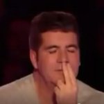 Simon smells his fingers