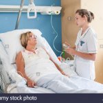 Patient in bed with nurse
