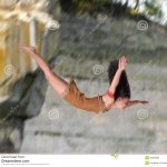 girl diving off cliff