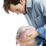 Weird stock photos 6 sad man holding blob fish