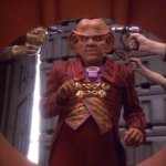 Quark With Guns Pointed At His Head