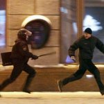 Protester Running From Riot Police