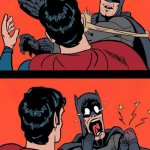 Batman slapping Super man
