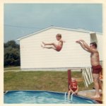 Dad throwing kid into pool