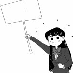 Komi-san holds the sign