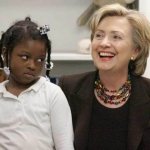 Hillary Clinton getting side eye from little black girl