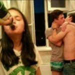 girl drinking while guys make out
