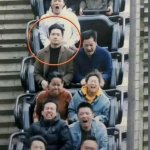 Serious man is not surprised in fast roller coaster