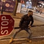 Man holding a stop sign meme