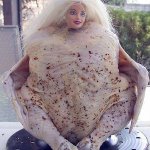 Raw chicken with doll head