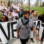 Protesters from UW boulder