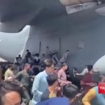 Afghans climbing on fly us air force airplane