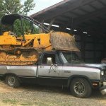 Bulldozer in Pickup truck