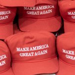 MAGA hats stacked