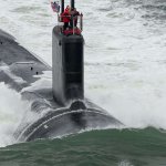 Submarine with dolphin escort