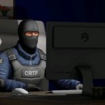 counter-terrorist looking at the computer