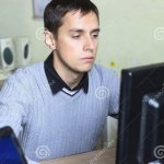 Sad man staring at computer