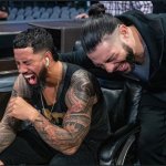 Jimmy Uso and Roman Reigns laughing