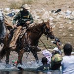 US horseback ranger lassoing an immigrant