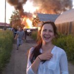 woman laughing burning house