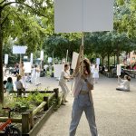 Girl with blank protest sign