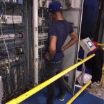 network engineer looking at server rack
