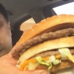 Man with a Mcdonalds Burger