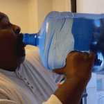 Man chugging water