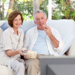 Middle-aged couple watching tv meme