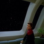 Captain Janeway looking out the window.