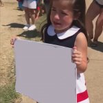Sad girl holding sign