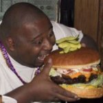 Fat guy eating Big-ass Burger