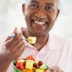 Man eating fruit