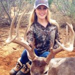girl holding deer rack