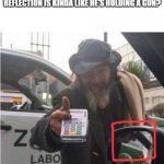 Homeless man with card reader | HEY SO... ANYONE NOTICED HIS CARD READER REFLECTION IS KINDA LIKE HE'S HOLDING A GUN? | image tagged in homeless man with card reader | made w/ Imgflip meme maker