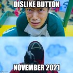 r.i.p. dislike button | DISLIKE BUTTON; NOVEMBER 2021 | image tagged in squid game gun | made w/ Imgflip meme maker